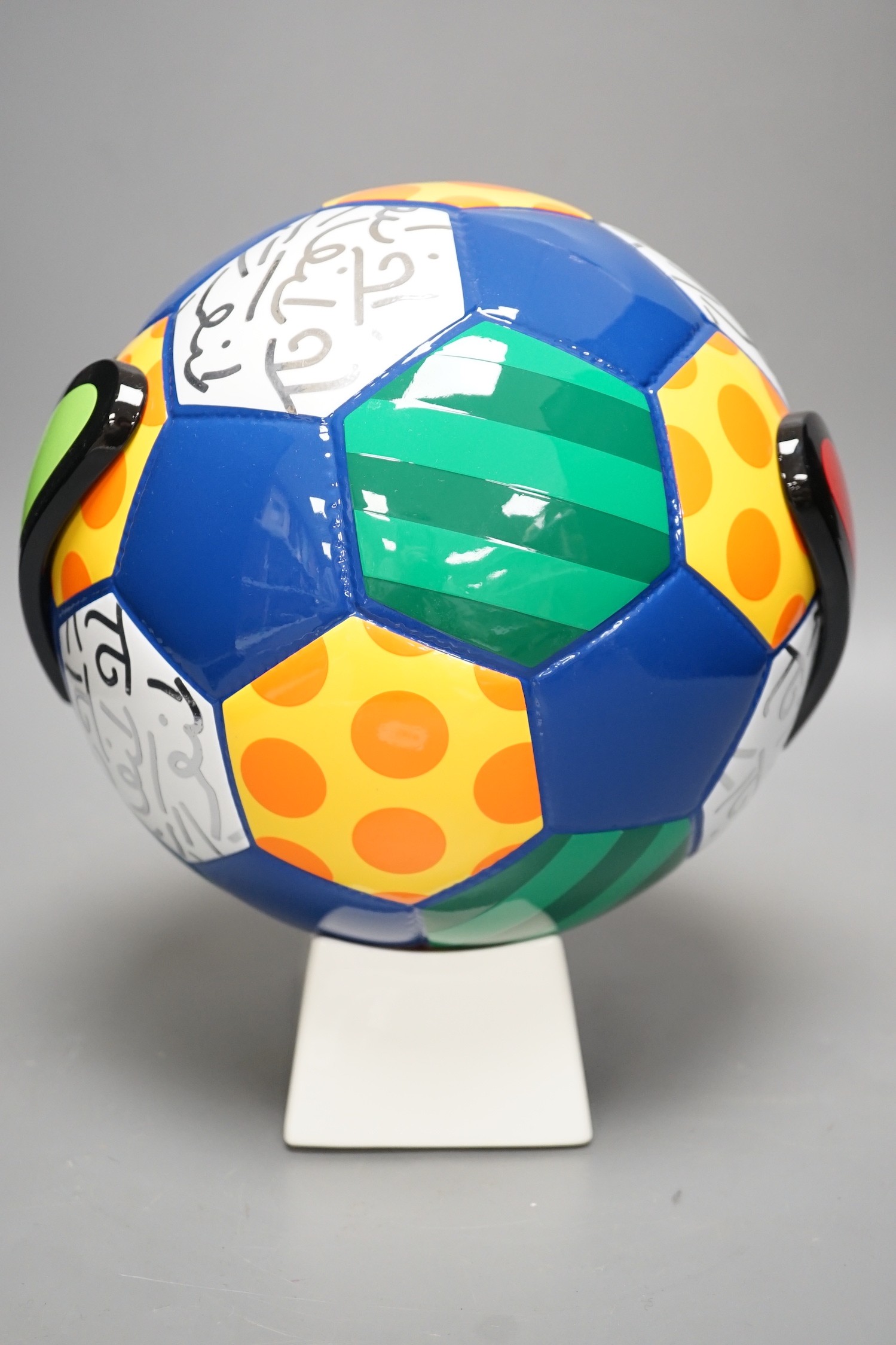 Romero Britto (Brazilian, 1963-), a ceramic football, 26cm